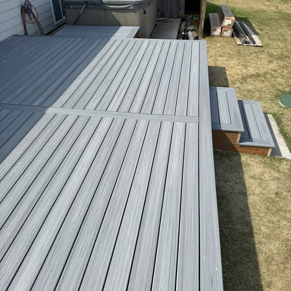 Siding & Deck Repairs in Bozeman - MT underway as a technician secures loose deck boards